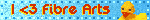a flashing rectangle with a rubber duck and the text I heart fibre arts